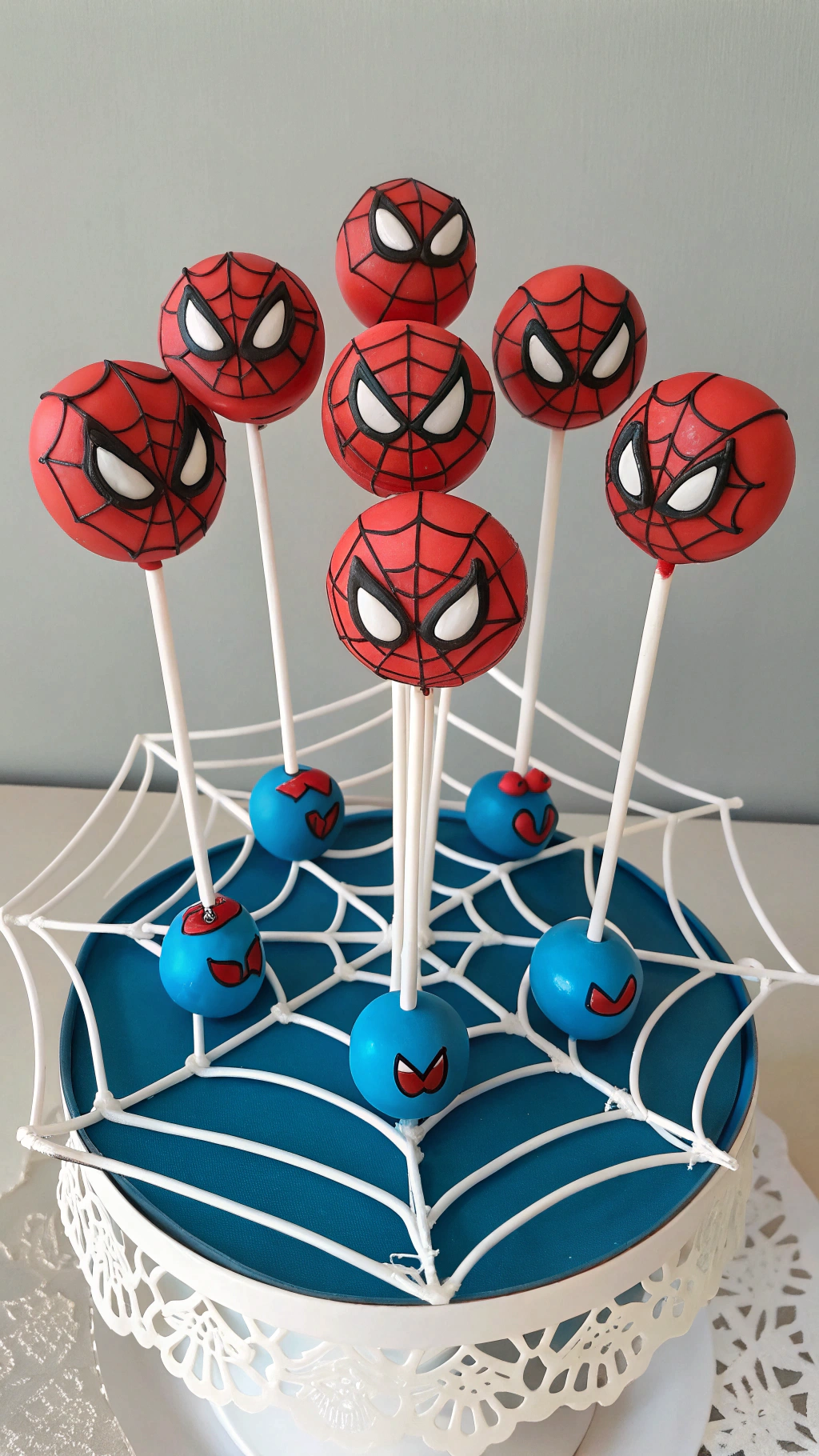 025 Web themed Spiderman cake pops for superhero birthday dessert tables for kids - Themed Ideas