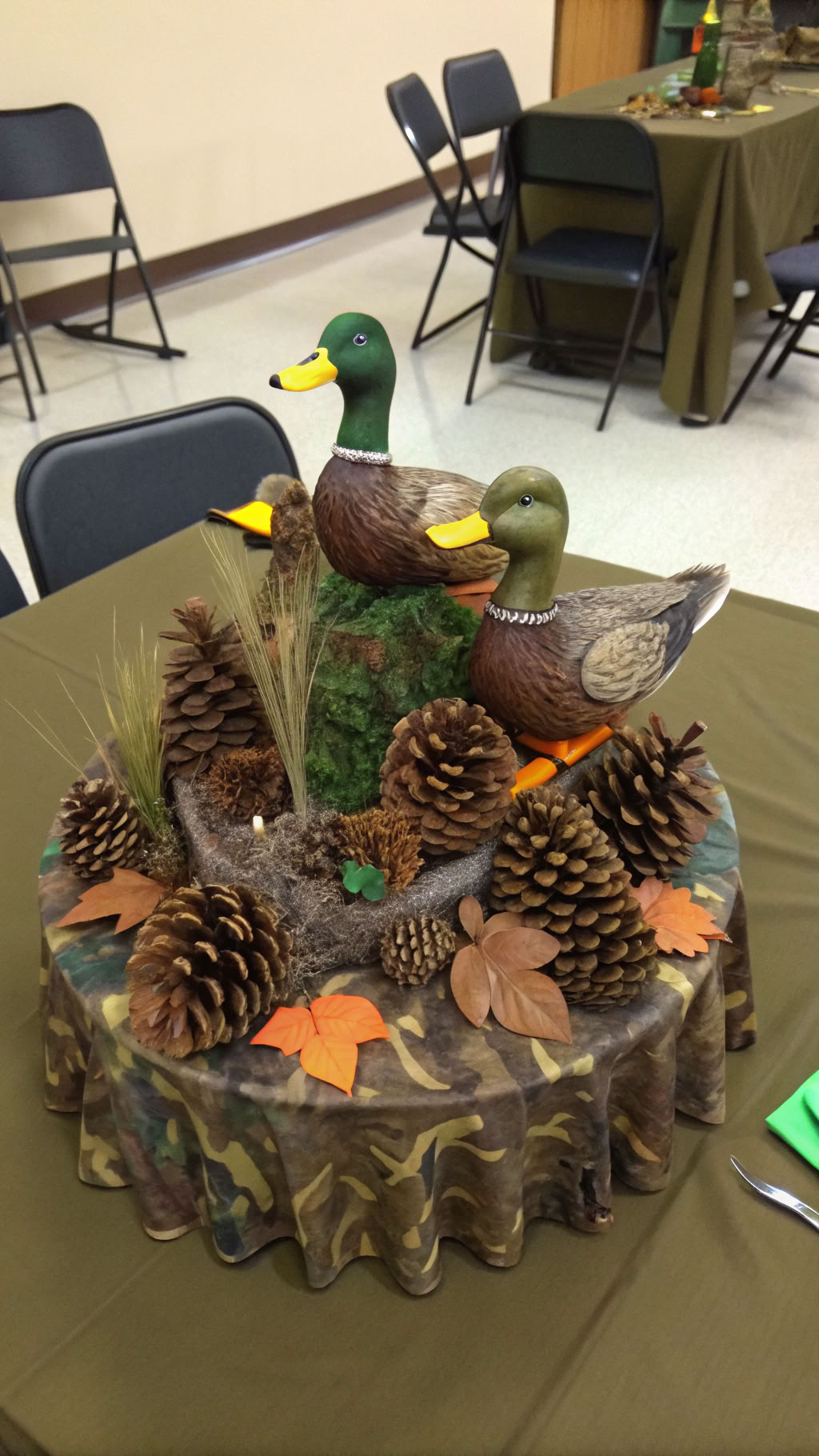 065 Duck Dynasty party centerpiece ideas with pinecones camo and duck figurines - Themed Ideas