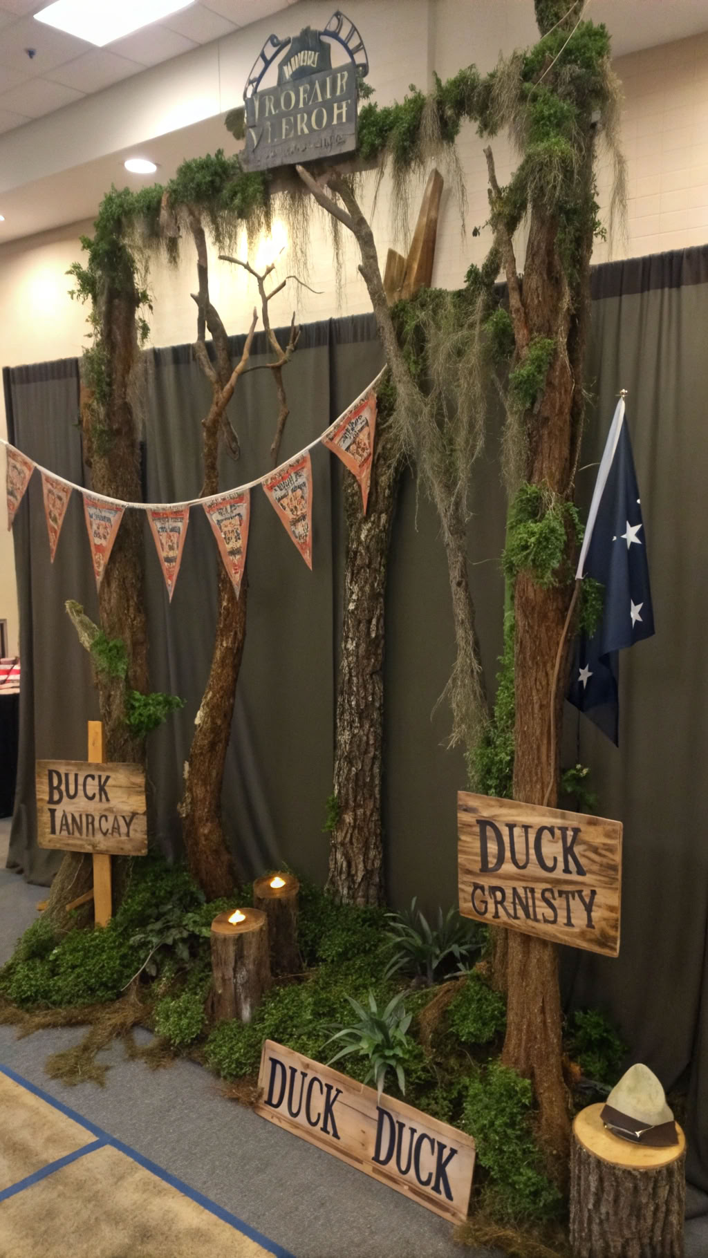 066 Duck Dynasty party backdrop ideas with camo flags and personalized rustic signs - Themed Ideas